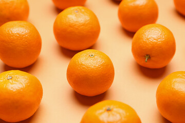 Sweet tangerines on color background, closeup
