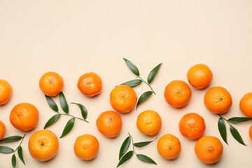 Composition with sweet tangerines and leaves on color background