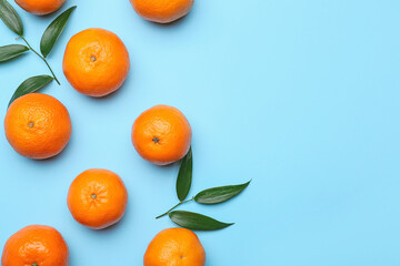 Composition with sweet tangerines and leaves on color background