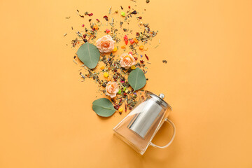 Composition with teapot, rose flowers and dry flowers on color background