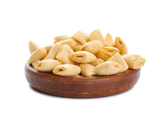 Plate with tasty corn pillows on white background