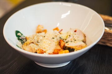 Children's portion of Caesar salad, in white deep plate