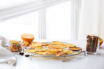 Dried orange slices on light background