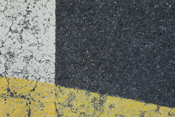 Fototapeta premium Grey asphalt road with white and yellow lines, space for text, no person