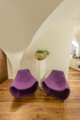 Lobby interior of a hotel with armchairs.