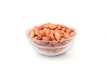peanuts in a glass bowl on a white