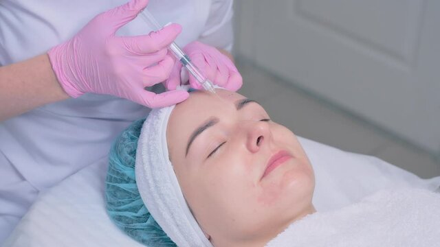 Woman on the procedure of mesotherapy injection