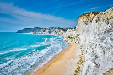 View of the incredible beach of Scala dei Turchi - a massive limestone rock formation on the coast of Agrigento, Sicily 