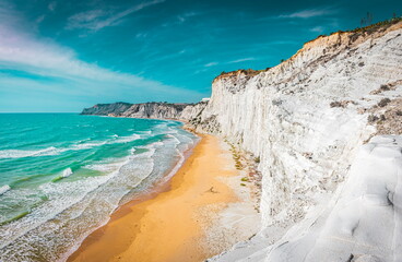 View of the incredible beach of Scala dei Turchi - a massive limestone rock formation on the coast of Agrigento, Sicily 