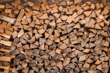Stack of firewood. Texture.