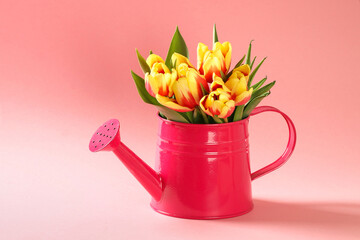A bouquet of tulips as a gift for March 8, Mother's Day, Valentine's Day. Easter decor. Flowers tulips on a pink background.