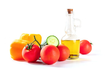Fresh tomatoes, bell peppers, a cucumber, and olive oil, gazpacho ingredients