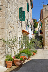 Fototapeta na wymiar A narrow street in the historic center of Split, an ancient city in Croatia.