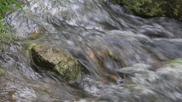 Running water through rocks. at Namtok Samlan National Park.Selective focus.