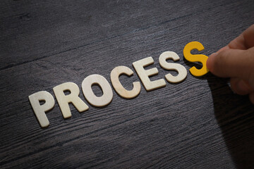Process, text words typography written with wooden letter on black background, life and business motivational inspirational