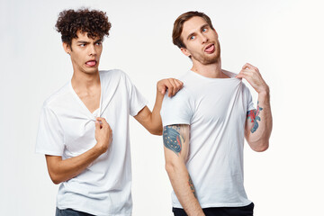 emotional men in white t-shirts antics fun isolated background