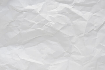 White crumpled paper texture background.