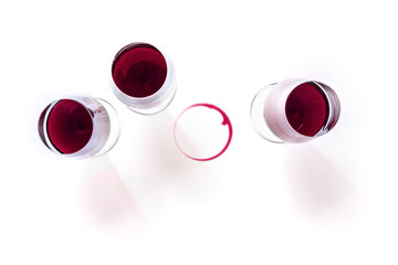Wine glasses and a wine ring, shot from the top on a white background