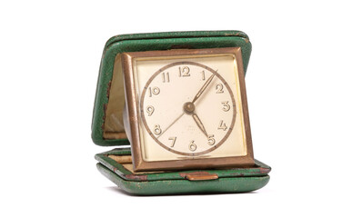 Old green folding travel alarm clock
