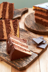 Chocolate cake on a wooden table. Side view