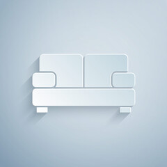 Paper cut Sofa icon isolated on grey background. Paper art style. Vector