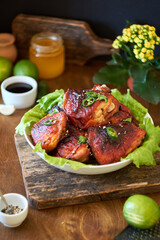 chicken thighs in spicy-sweet sause. Green hot peppers. lime, honey, garlic.