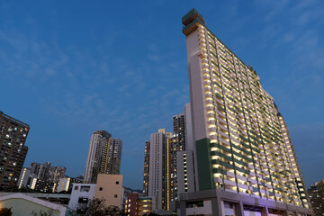 Fototapeta na wymiar Night scenery of high rise residential building of public estate in Hong Kong city