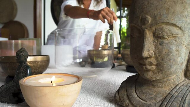 Sound healing Tibetan medicin Buddha sculpture and crystal bowls