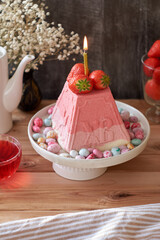 Traditional Easter Orthodox curd cake with strawberries. Traditional Easter cottage cheese dessert. Flowers, strawberries.