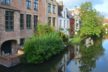 Fototapeta na wymiar The beautiful neighbourhood of Bruges. Bruges is the capital and largest city of the province of West Flanders in the Flemish Region of Belgium.