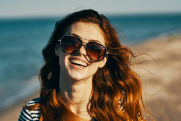 young traveler sunglasses portrait closeup sea landscape beach