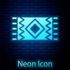 Glowing neon Mexican carpet icon isolated on brick wall background. Vector