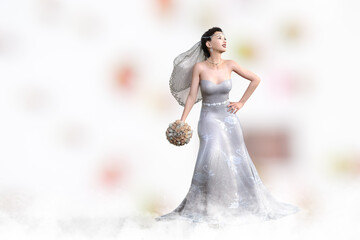 Fototapeta na wymiar デコルテの綺麗な純白のウエディングドレスを着た花嫁がブーケトスをする