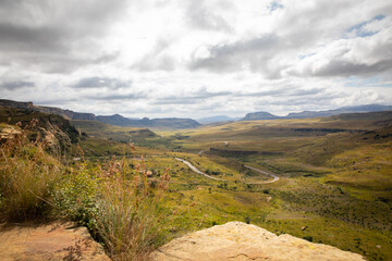 Over looking valley with winding road and rolling hills in Golden Gate National Park, Free State. 