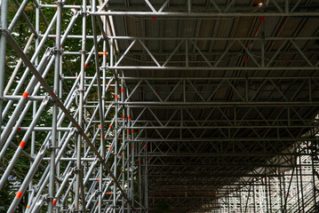 Huge metallic scaffold for building a bridge, view from below
