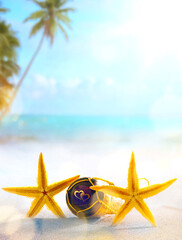 Naklejka na ściany i meble Art Honeymoon trip concept. Love on the beach symbol; Tropical holiday’s background.