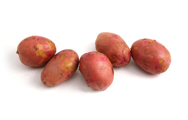A group of five raw potato tubers isolated on a white background. A culinary ingredient. Natural healthy food. Vegetable. Horizontal frame.