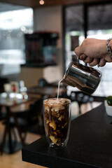 glass of coffee with milk on the table
