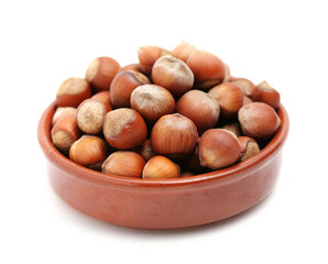 hazelnuts in a bowl isolated on white background