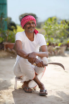 Indian Farmer is sitting in field	