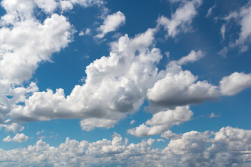Naklejka na ściany i meble Clouds are moving on the blue sky, weather background.