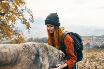 woman hiker hugging dog nature patriarch vacation