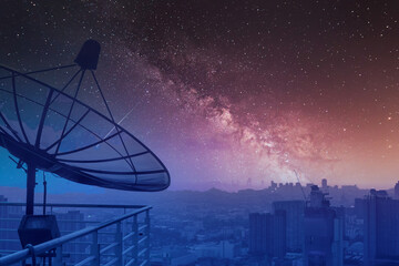 Satellite dish at night sky and stars background, View of high rise buildings in Bangkok At night...