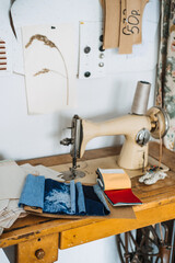 Supporting local, Tailoring small business. Seamstress, dressmaker, designer retro style workplace. Sewing machine with fabric samples, Threads and needles.