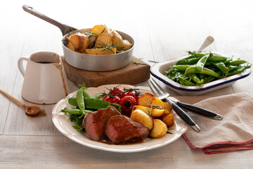 Meat and three veg, beef snow peas and gravy, promotional shot