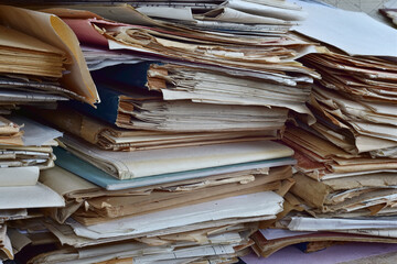 Old, randomly folded paper, as waste paper.