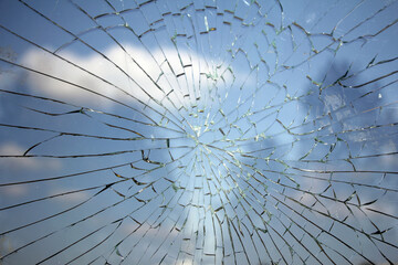 Glass broken cracks splinters in front of the bus station