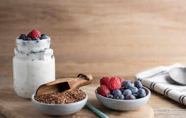 Healthy super foods flax seeds in a bowl mixed with yoghurt ready to eat. These seed are very healthy and can be eaten with a variety of different dishes.