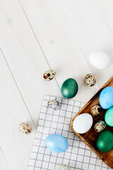 Easter church holiday colorful eggs on chalkboard and wooden table top view