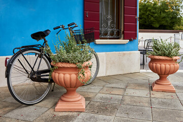 Fototapeta na wymiar Bicycle on blue wall background